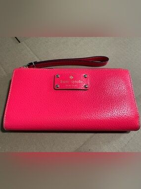 kate spade hot pink leather wristlet wallet with gold logo